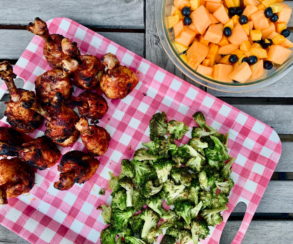 Chicken Lollipops with grilled broccoli and fruit Salad 