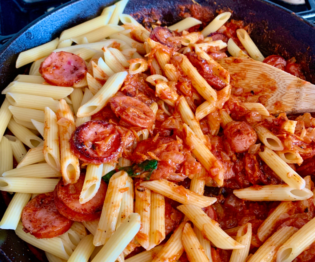 Red Sauce Penne Pasta being stirred