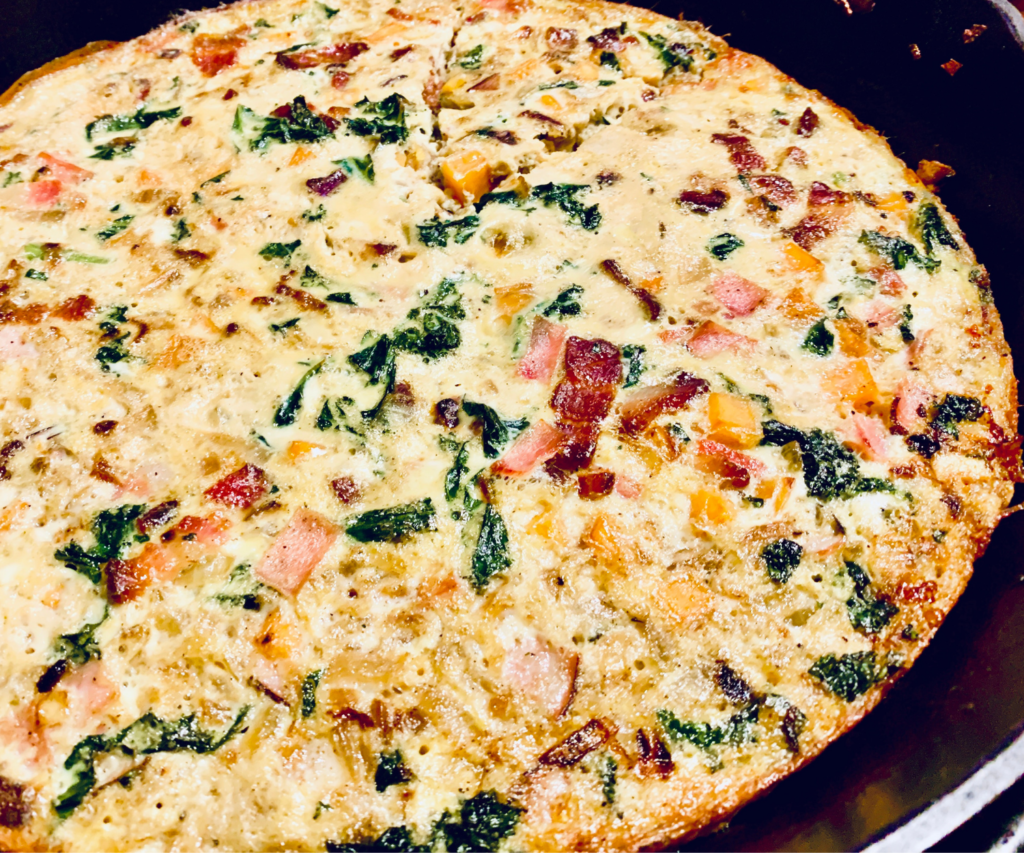 Sweet Potato and Kale Fall Frittata in a cast iron skillet