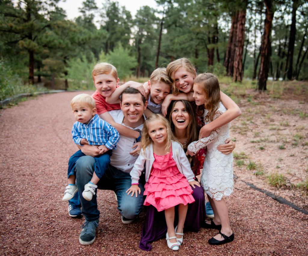 Family Huddled together at a park